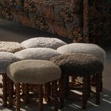 Pair of mid-century Danish oak stools with shearling lambswool upholstery, 1950s.