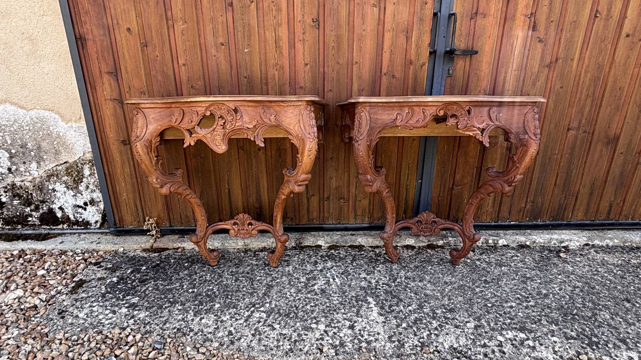 Pair of carved wall consoles in Louis XV style