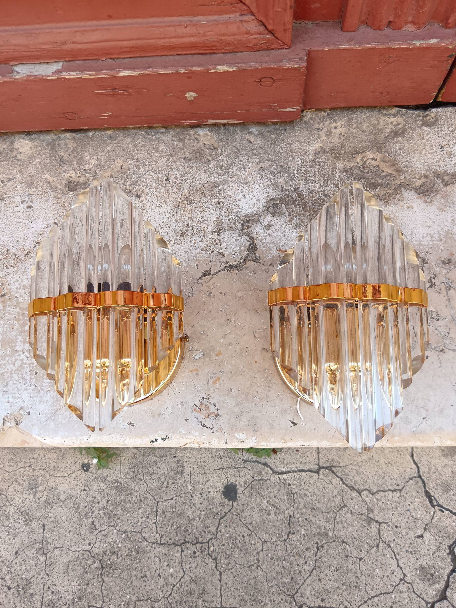 Pair of wall sconces in crystal glass and gilded brass. Venini style.