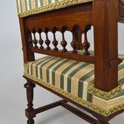 Neo-Renaissance walnut armchair with lion heads, circa 1880