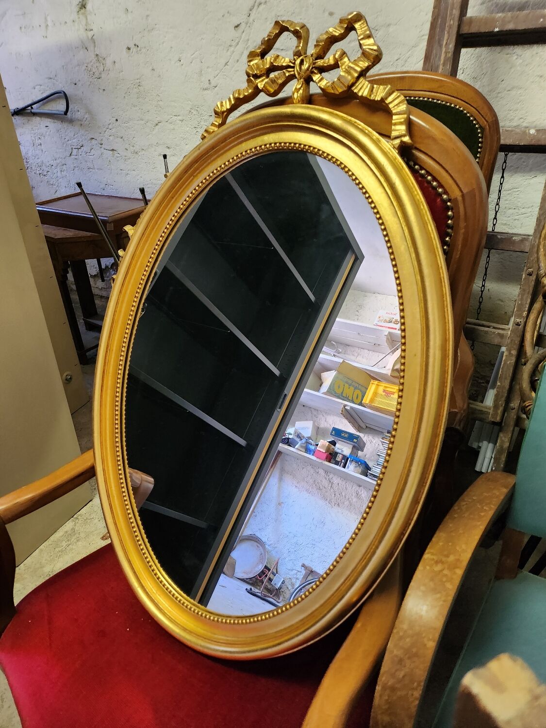 Vintage oval bow tie mirror
