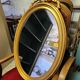 Vintage oval bow tie mirror