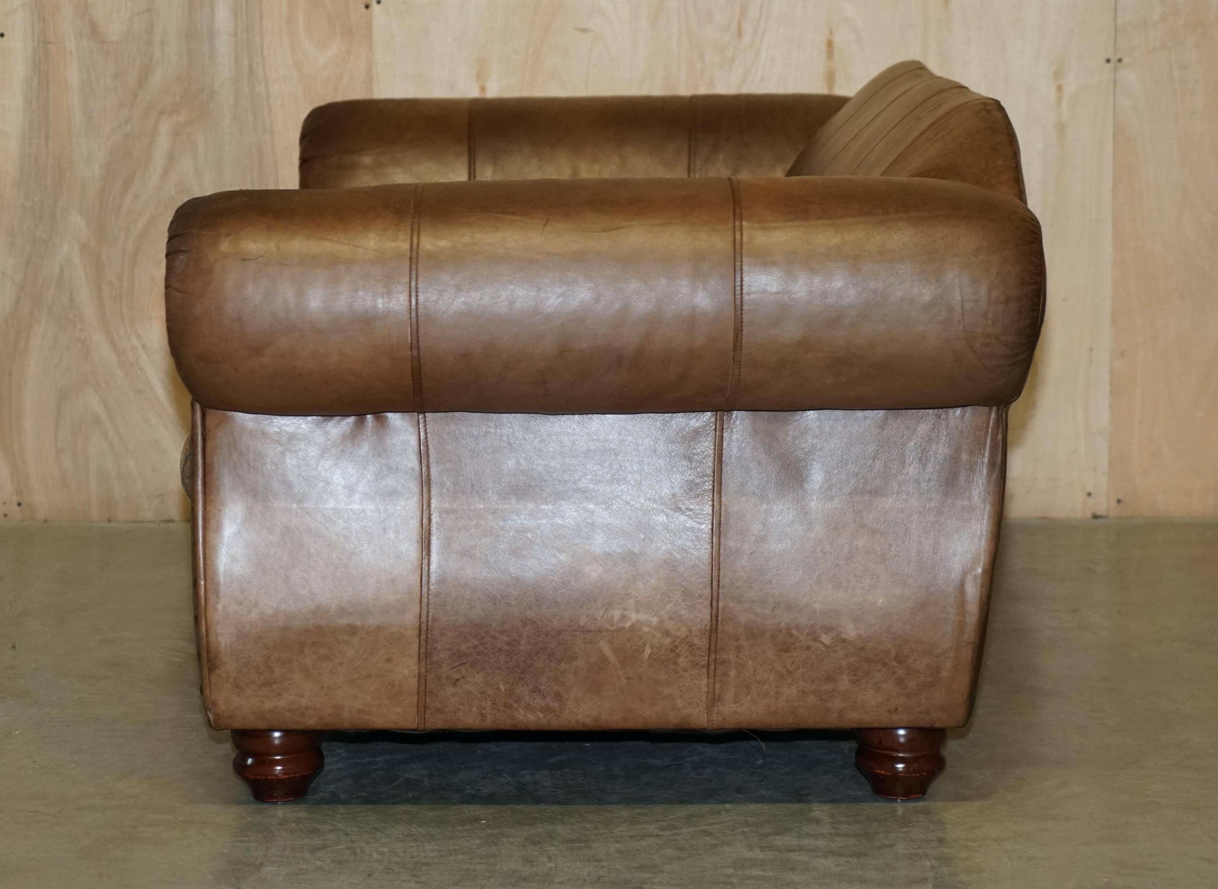 Vintage leather sofas by Thomas Lloyd with Kilim cushions.