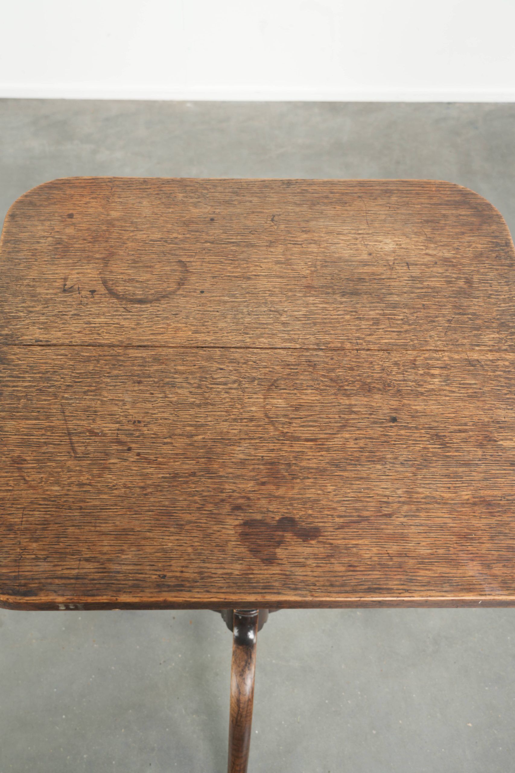 Antique English oak tilt top table from the 19th century in a unique shape