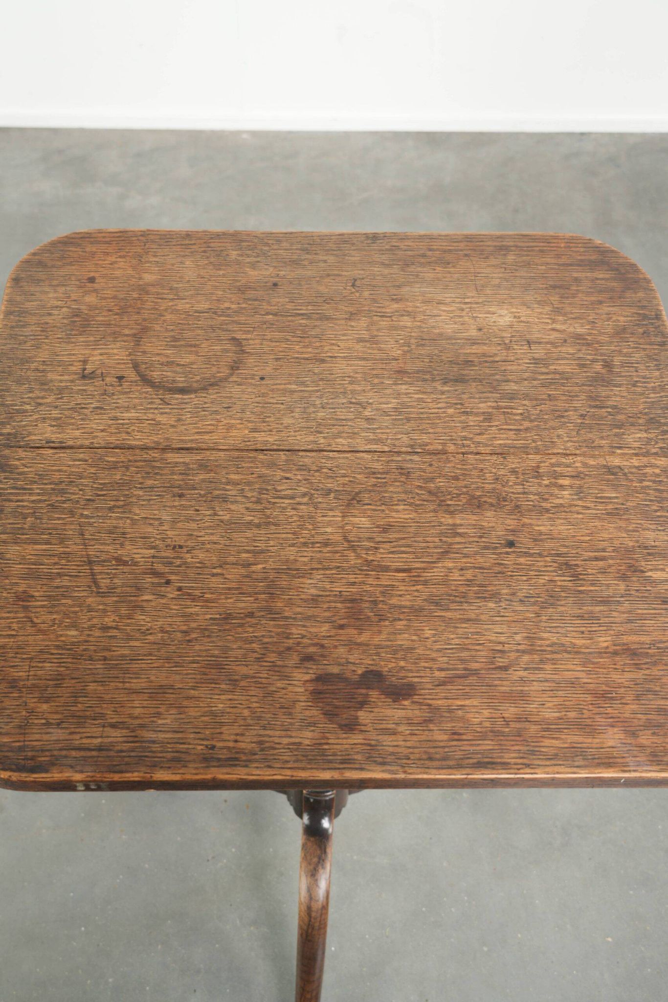 Antique English oak tilt top table from the 19th century in a unique shape