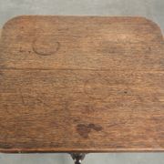 Antique English oak tilt top table from the 19th century in a unique shape