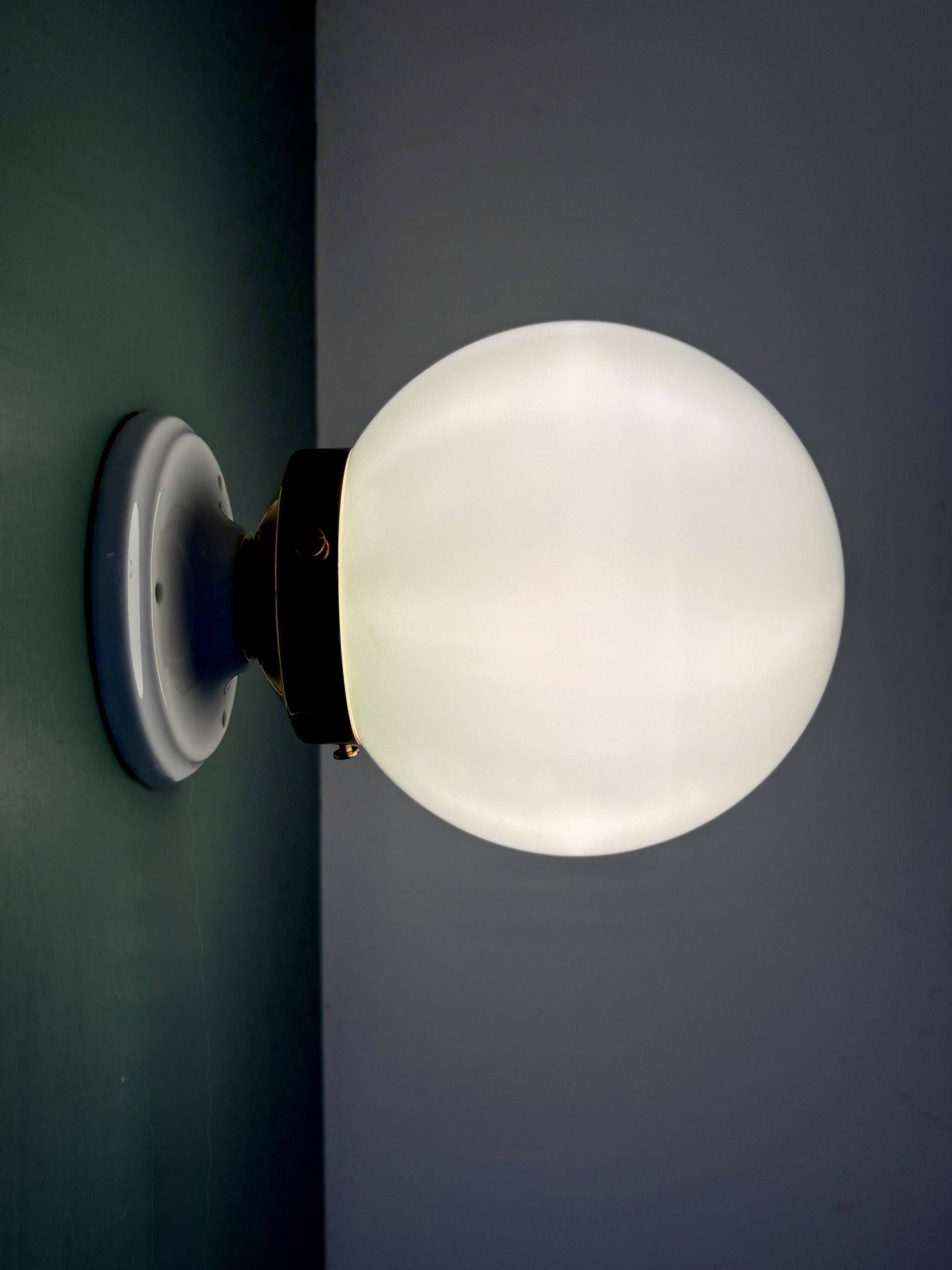 Vintage globe wall or ceiling light in white opaline.