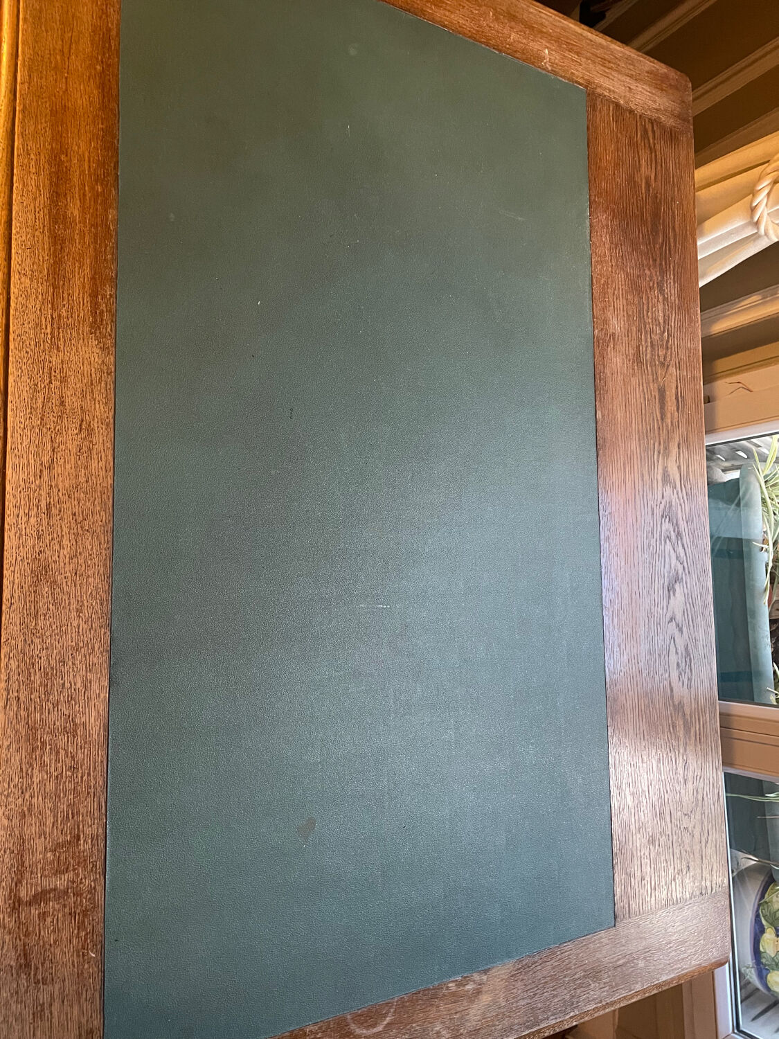 Solid wood desk and green leather writing pad