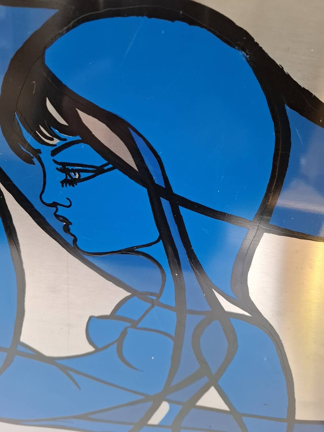 Silkscreen on brushed aluminium from the 1970s.