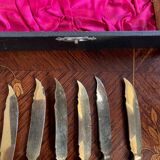 Set of knives and forks for fruits.