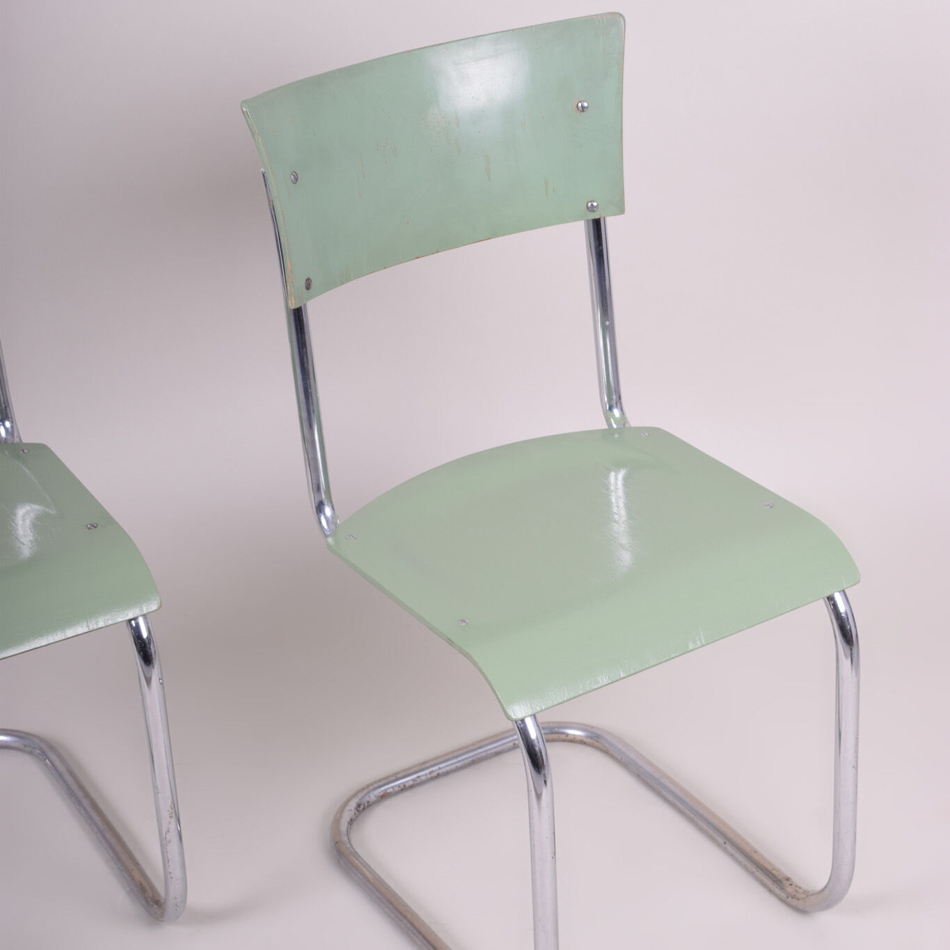 Pair of green Bauhaus chairs made in 1930s Czechia. Made by Robert Slezák