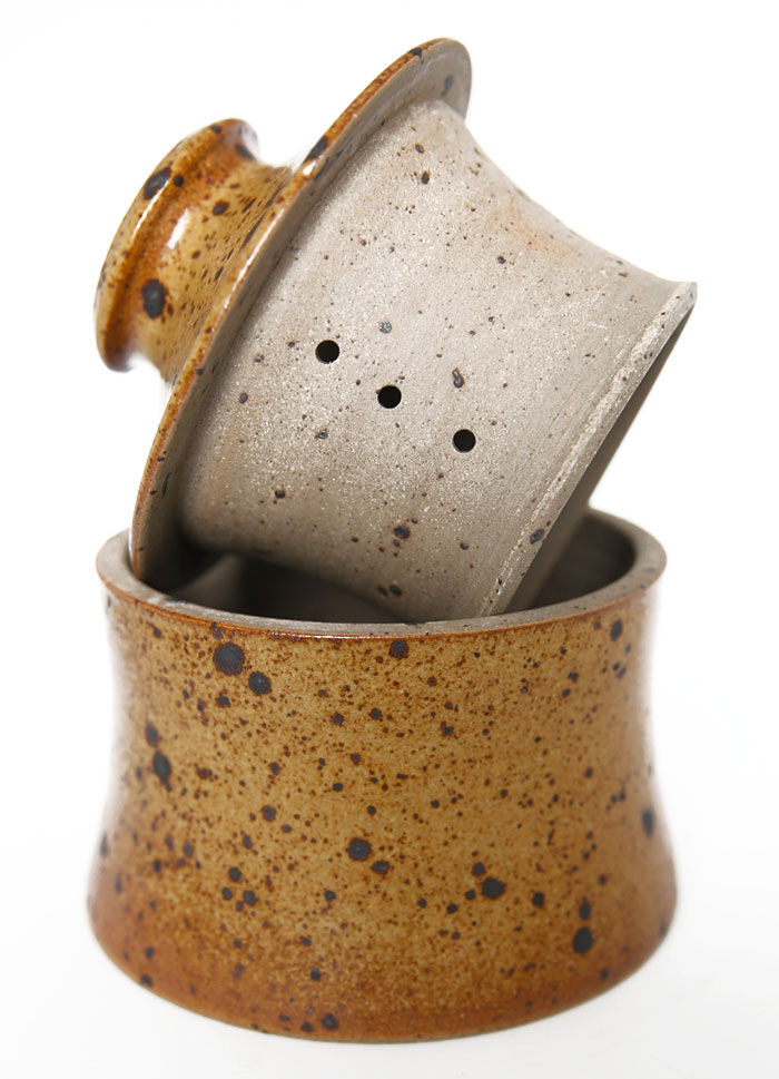 Handmade and rustic water butter in pyrity sandstone