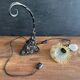 Art Nouveau wall light in wrought iron with vine decoration, early 20th century.