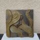 Bas relief en pierre style Art Déco, femme cheveux au vent