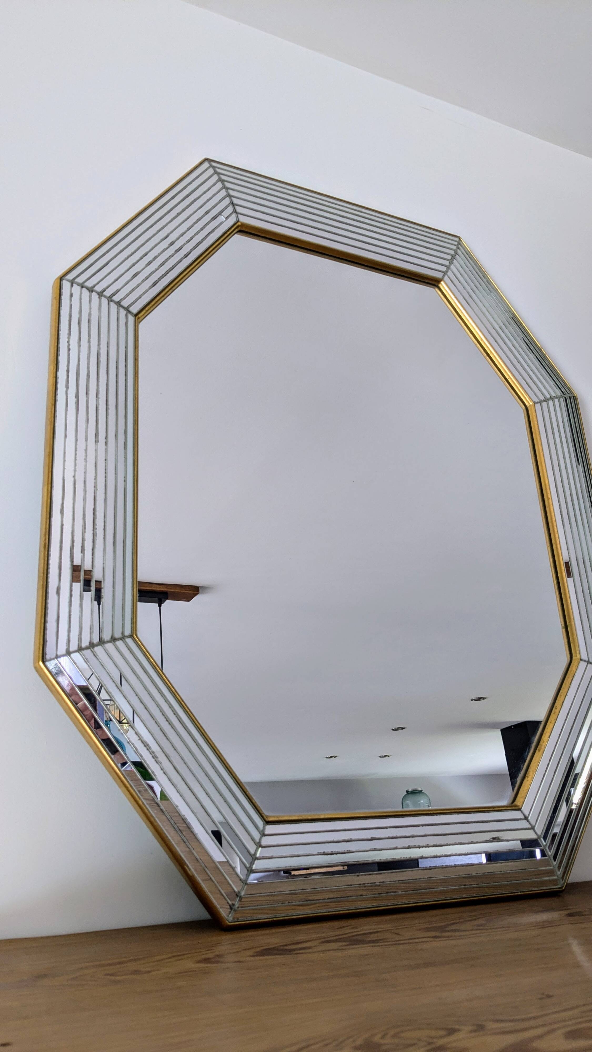 Octagonal mirror with brass parcloses by Jan Deknudt