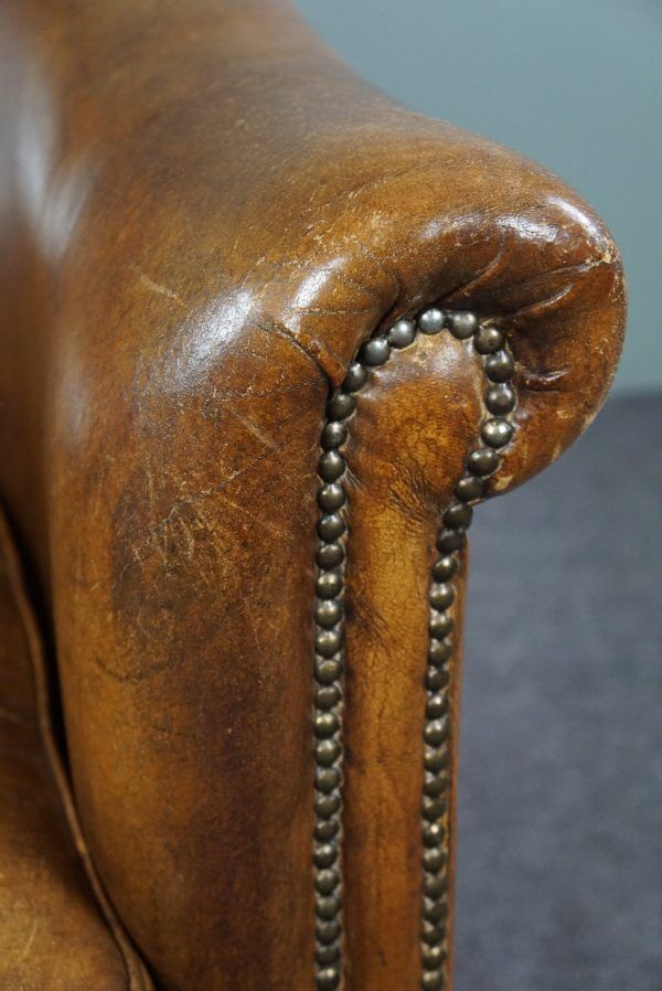 Club chair in patinated sheepskin