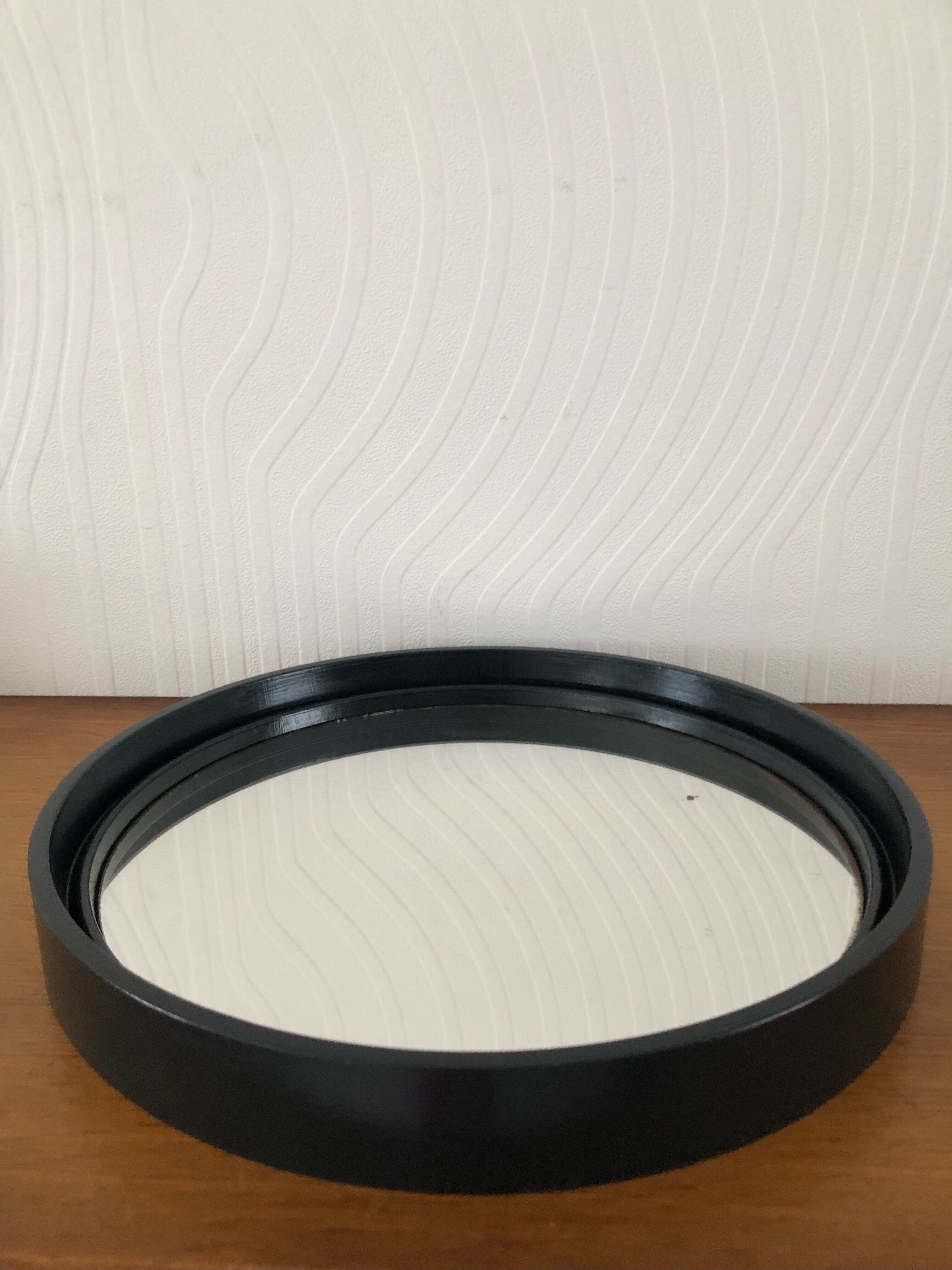Vintage round mirror in black gilac plastic