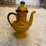 Teapot in yellow ceramic with the logo