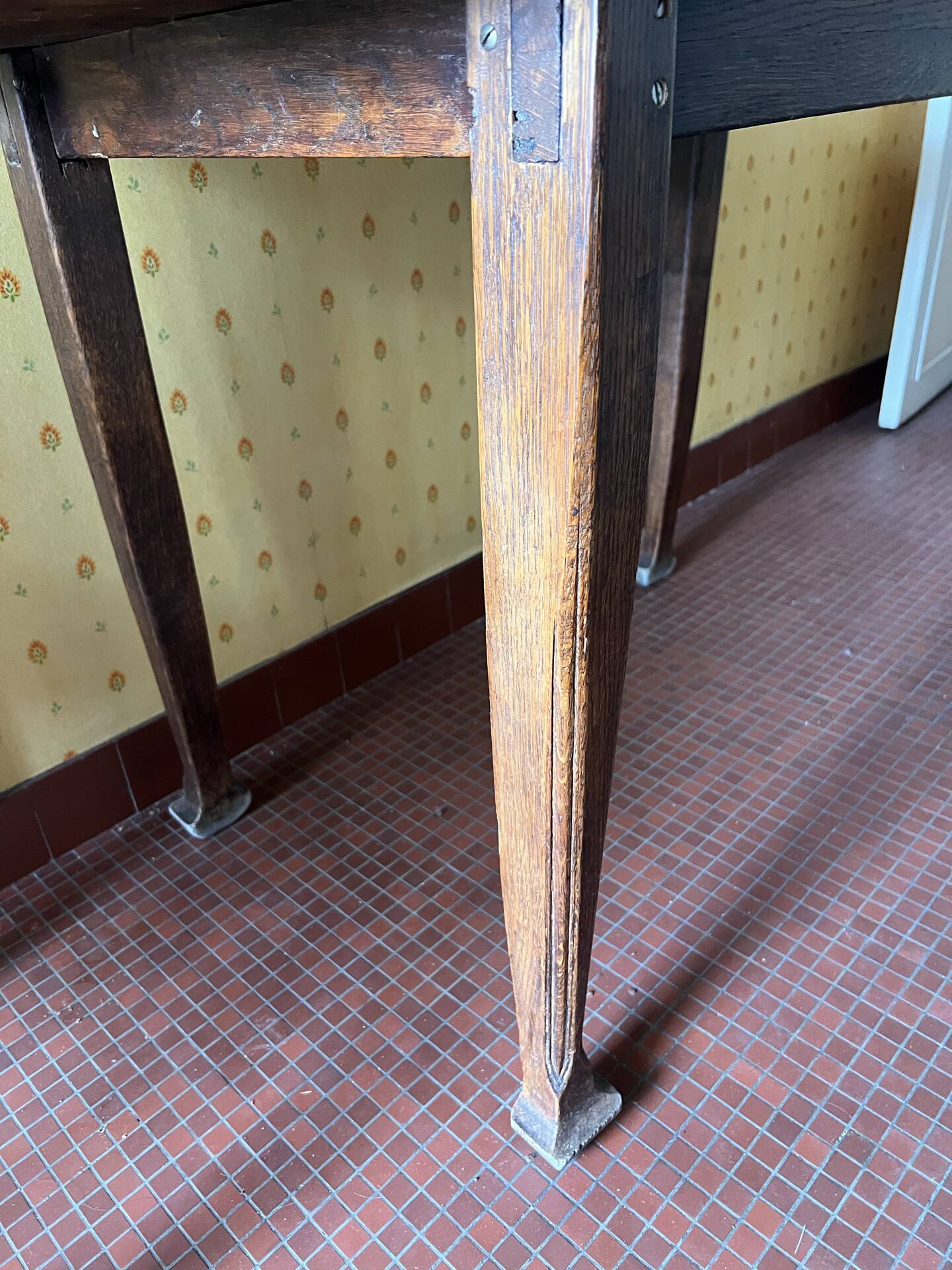 Vintage antique oak table with ornate legs.