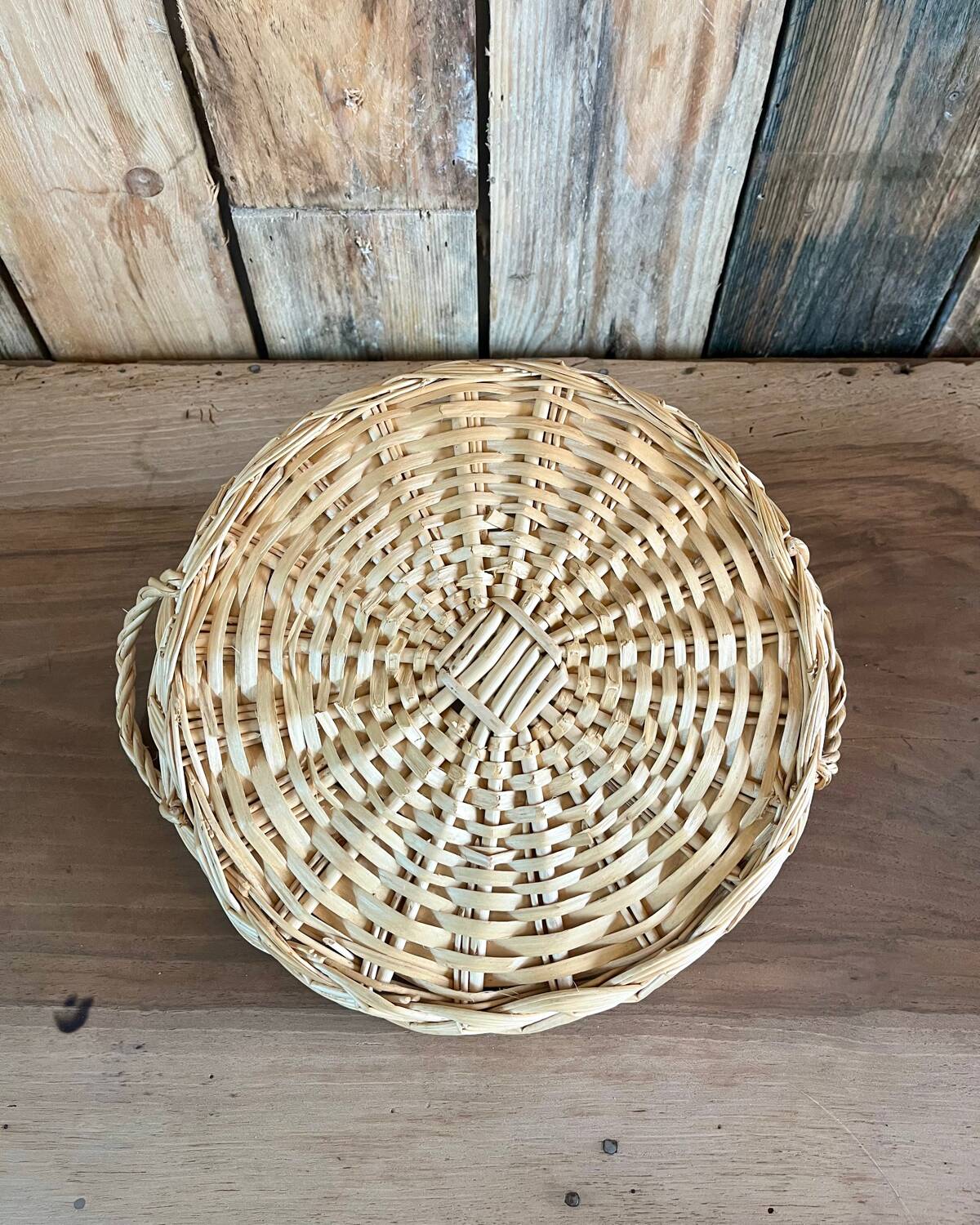 Vintage round flat rattan basket