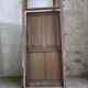 Old solid oak front door with frame and transom from the 19th century.
