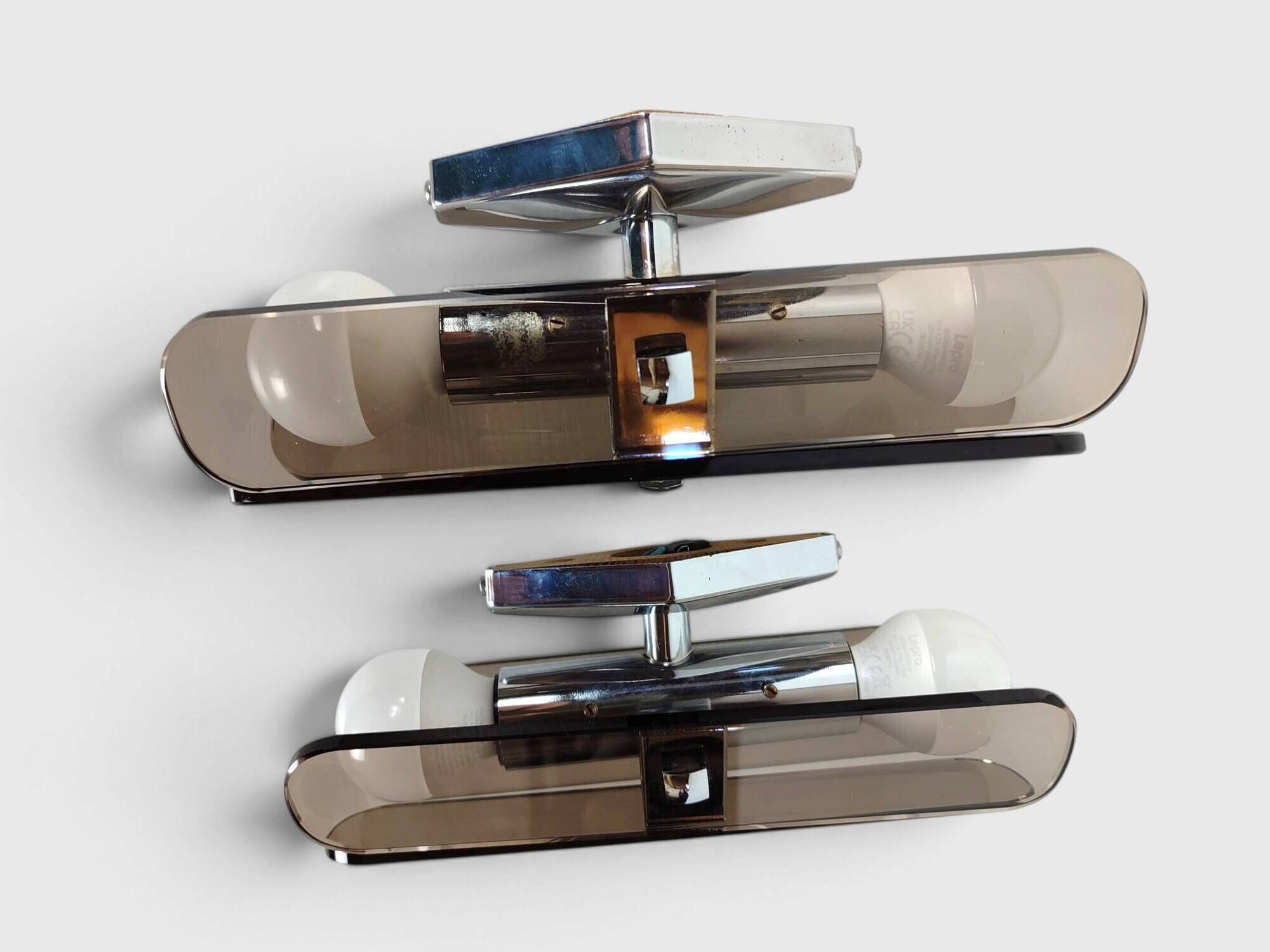 Pair of smoked glass and chrome wall lights attributed to Fontana Arte – Years