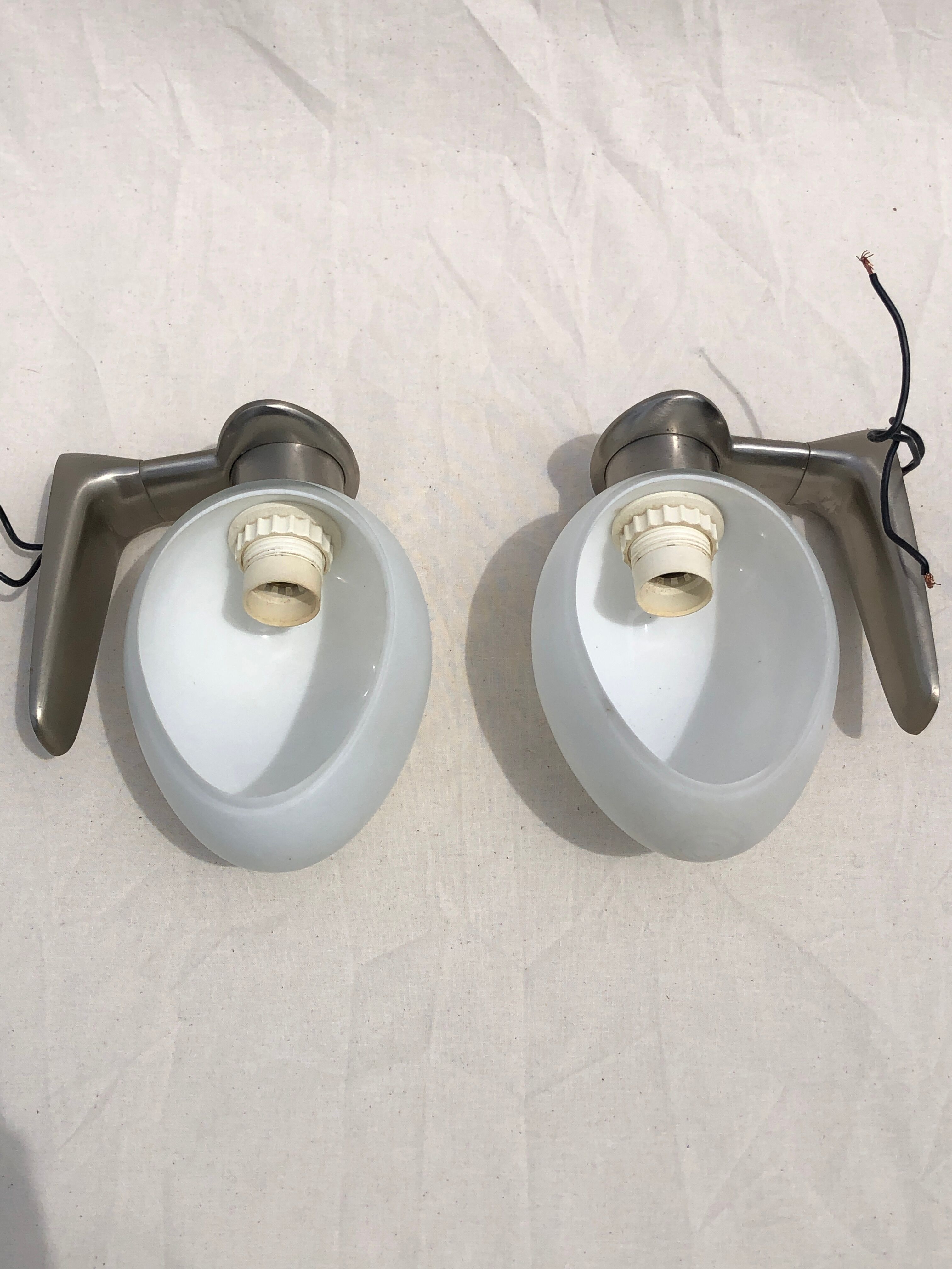 Pair of brushed steel appliques, half-egg opaline, 1970