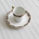 7 Limoges porcelain cups and saucers with gold decoration and floral motif.