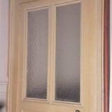 Large glazed door and its old glazed transom.