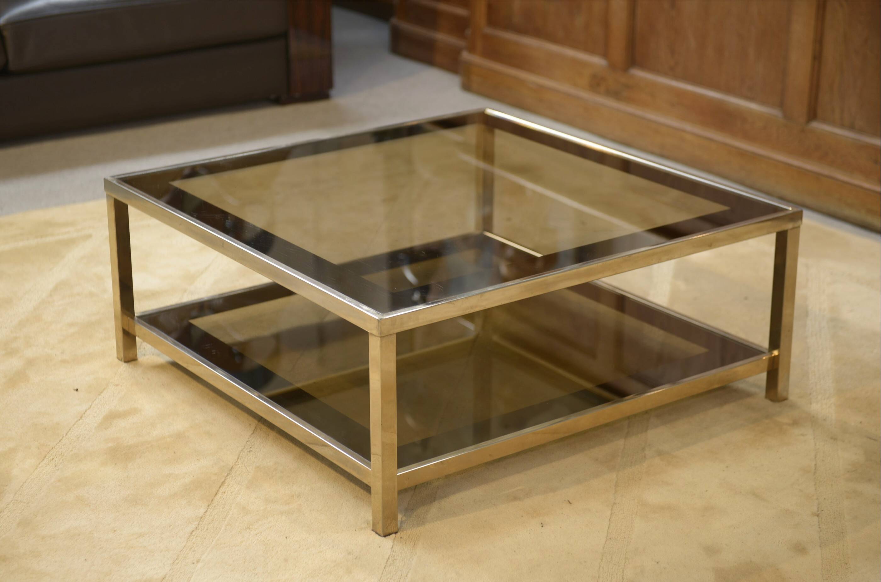 Hollywood Regency coffee table in smoked glass with mirrored framing from the 1970s.