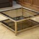 Hollywood Regency coffee table in smoked glass with mirrored framing from the 1970s.