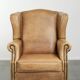 Comfortable cowhide wingback armchair with a timeless English look
