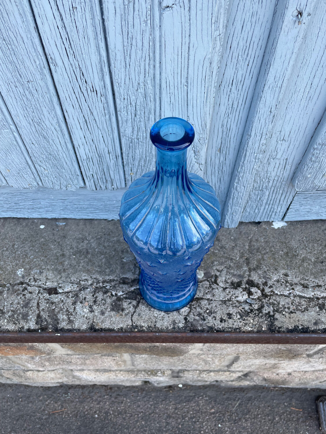 Blue glass decanter with a moon star motif