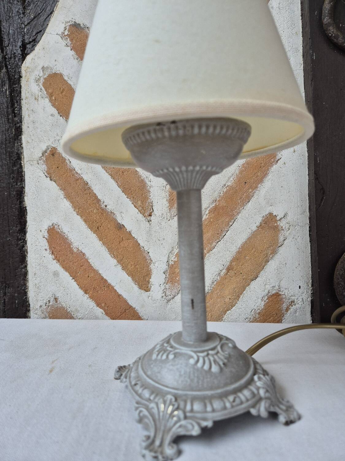 Patinated taupe bedside lamp