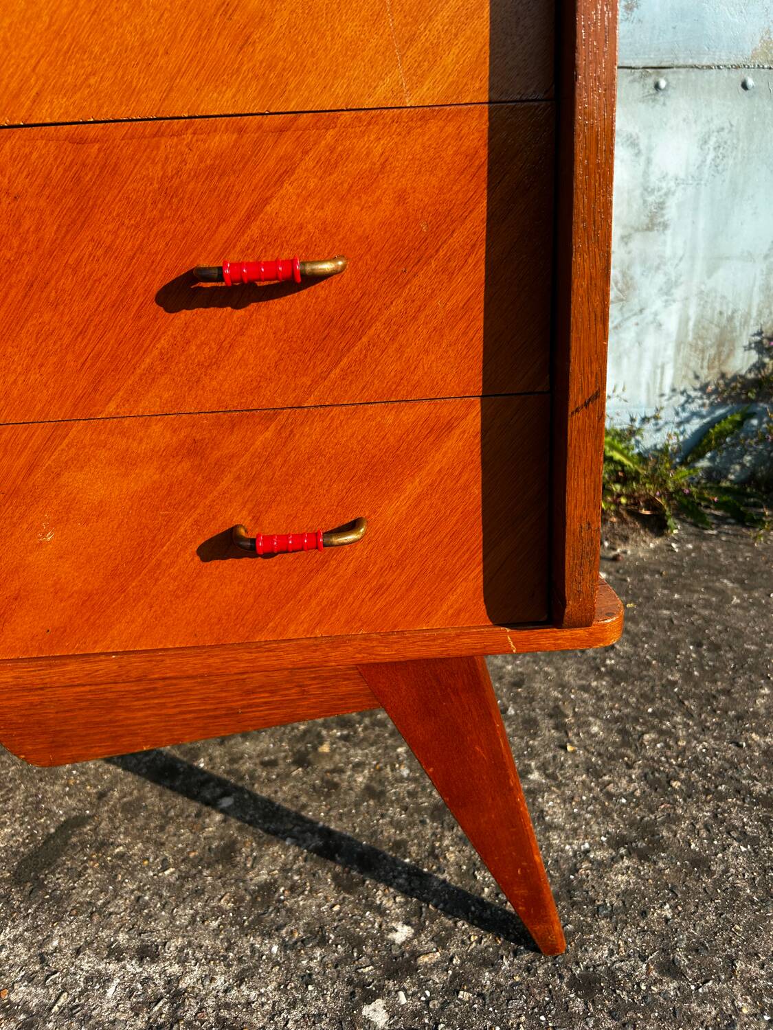 Vintage chest of drawers with compass feet.