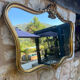 Miroir en bois doré sculpté et mouluré