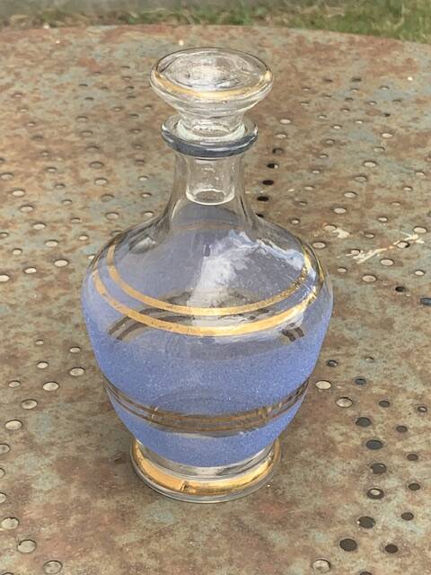 Blue granite glass carafe with vintage gold trim.
