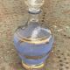 Blue granite glass carafe with vintage gold trim.