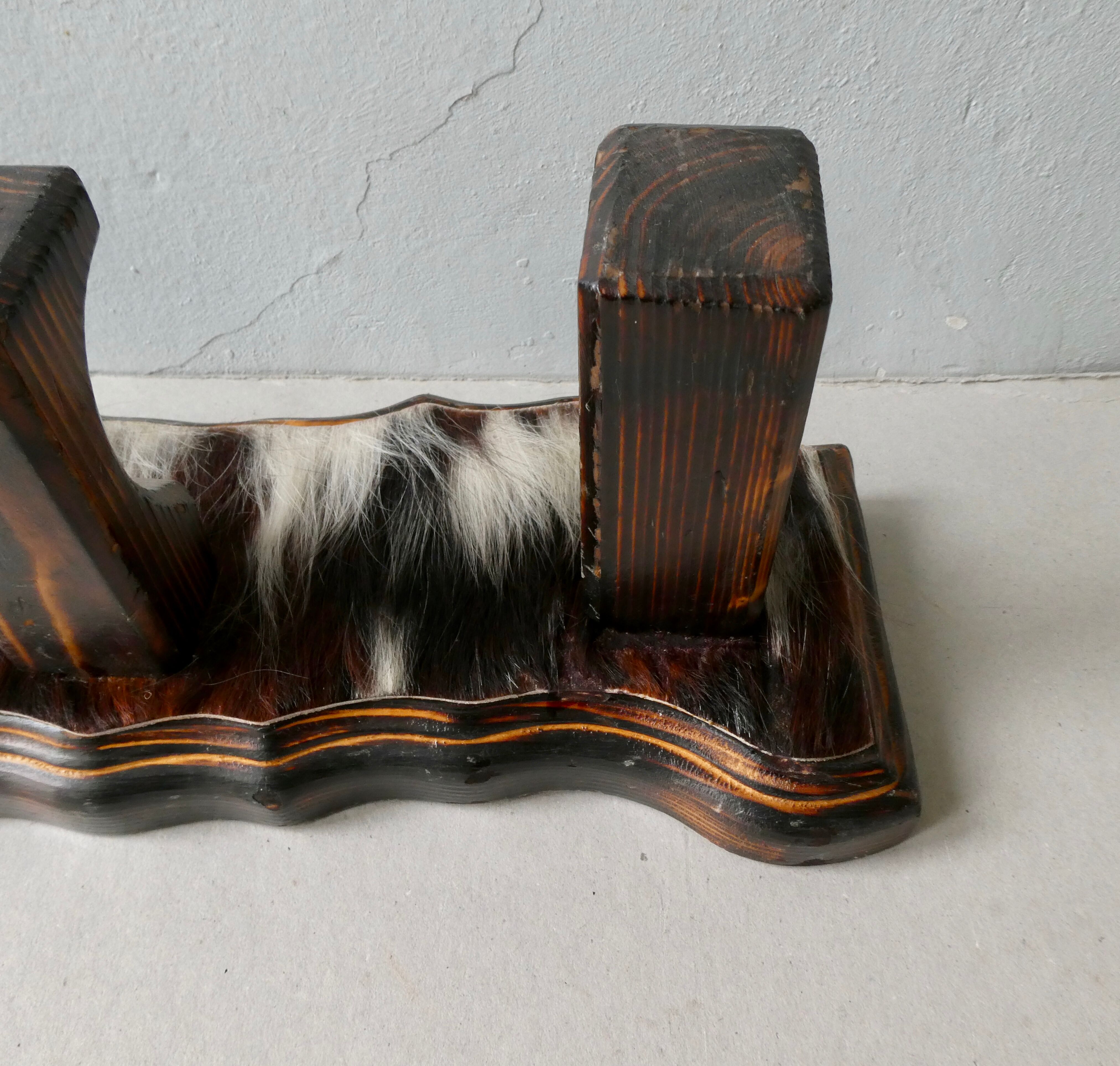 Wall hanger in burnt pine and cow skin