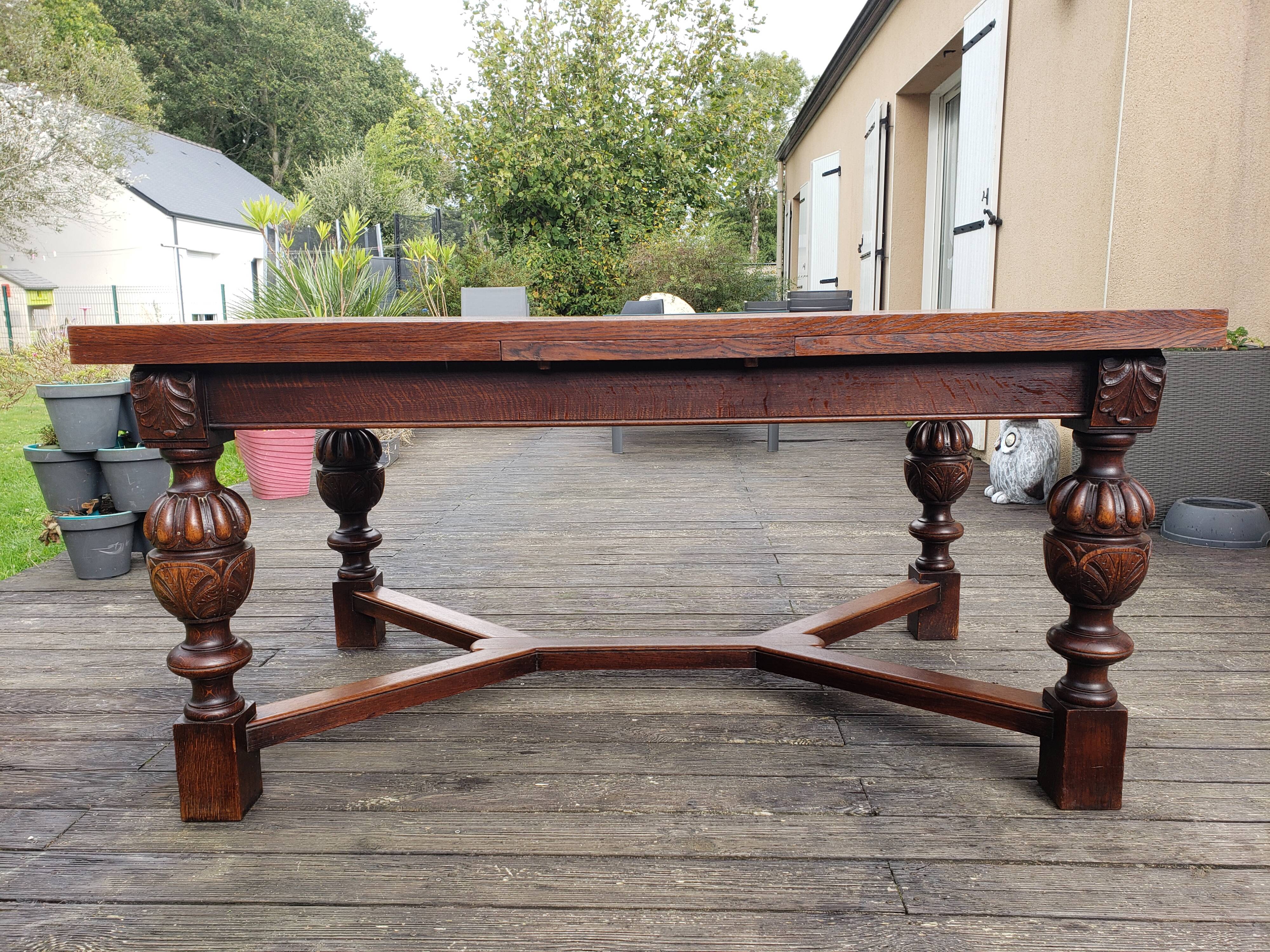 1910s Jacobean style solid oak extending drawer dining table