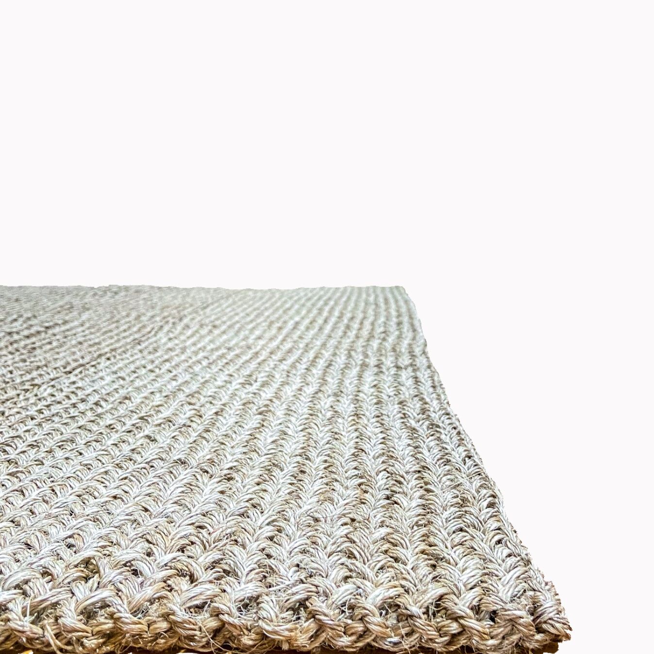 Handmade carpet in natural fiber of knitted palm leaf