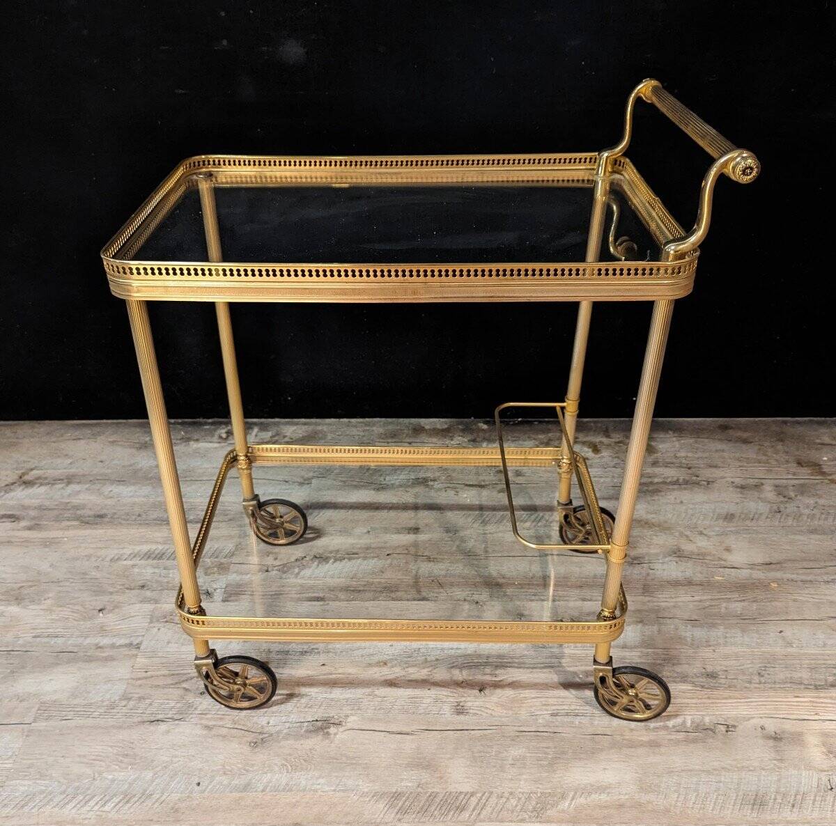 1970s serving trolley in brass and gilded bronze.
