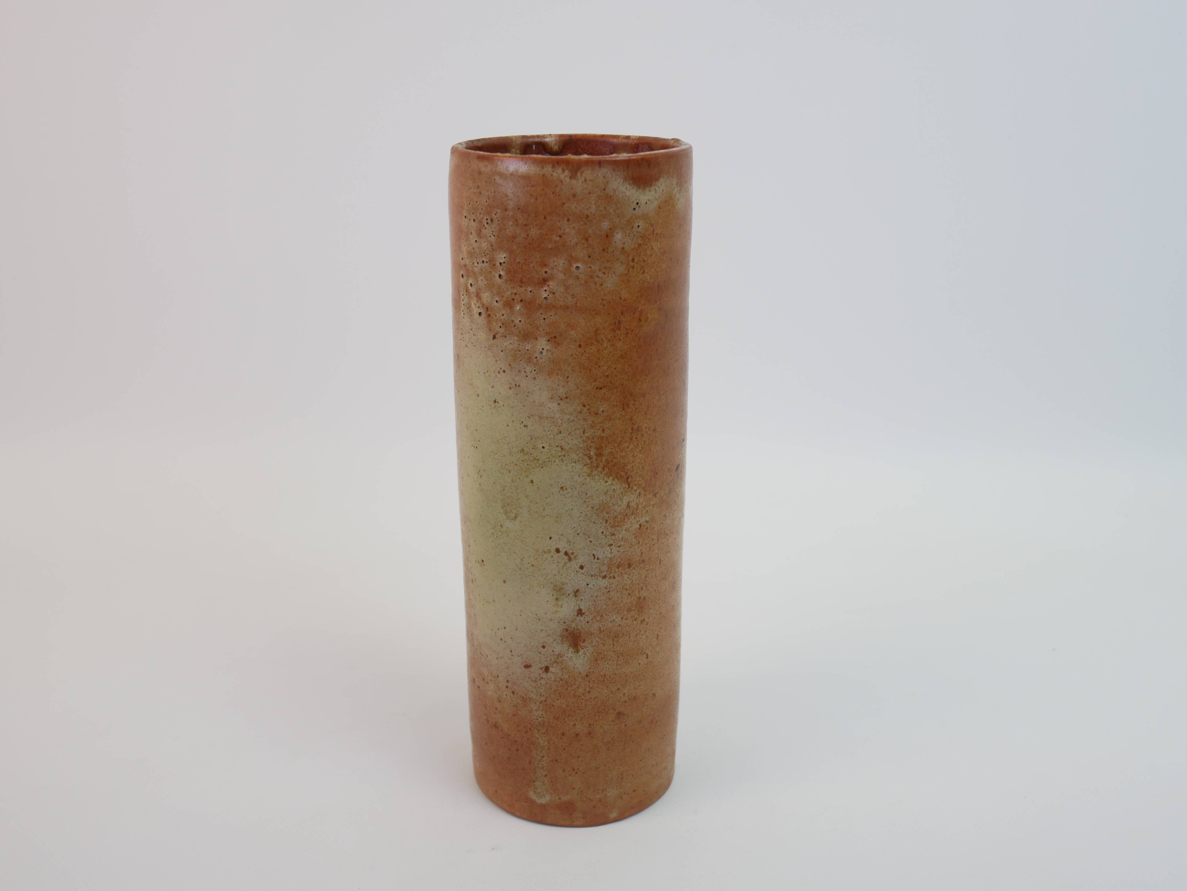 Brown ceramic tube vase signed Roger Jacques under the base