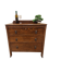 Antique chest of drawers on wheels with wood carving (key top drawer)