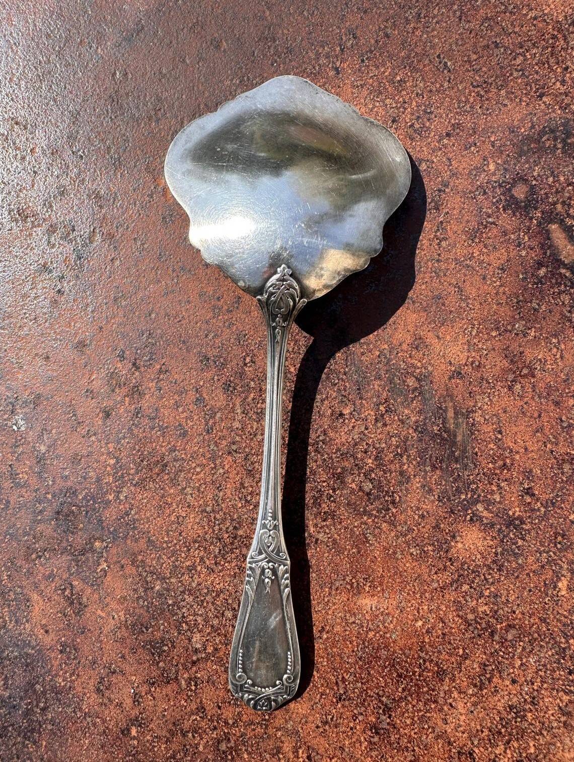 Strawberry spoon or antique Art Nouveau fruit salad in silver metal.