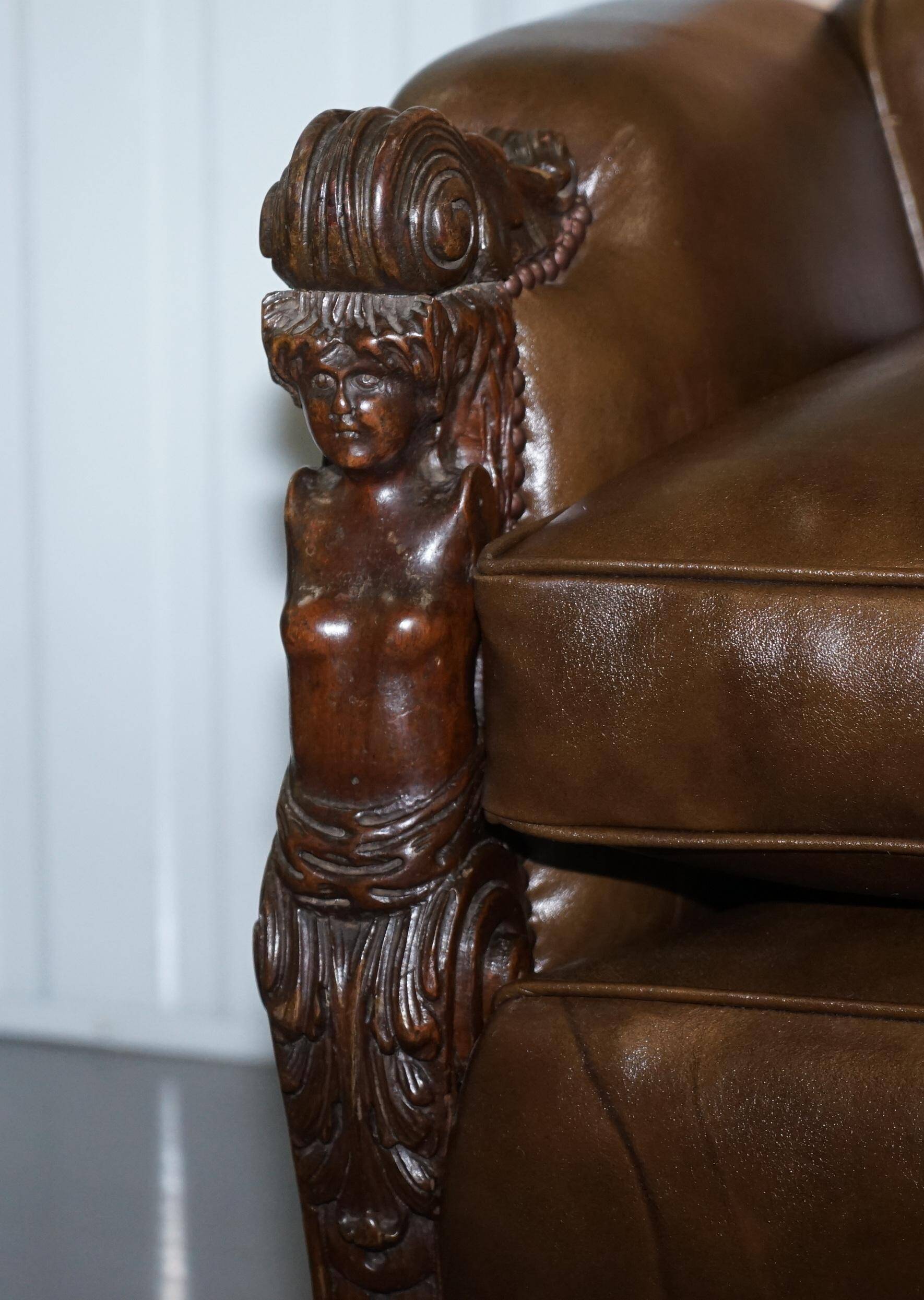 Restored Regency canapé in leather with sculpted Hermès frame.
