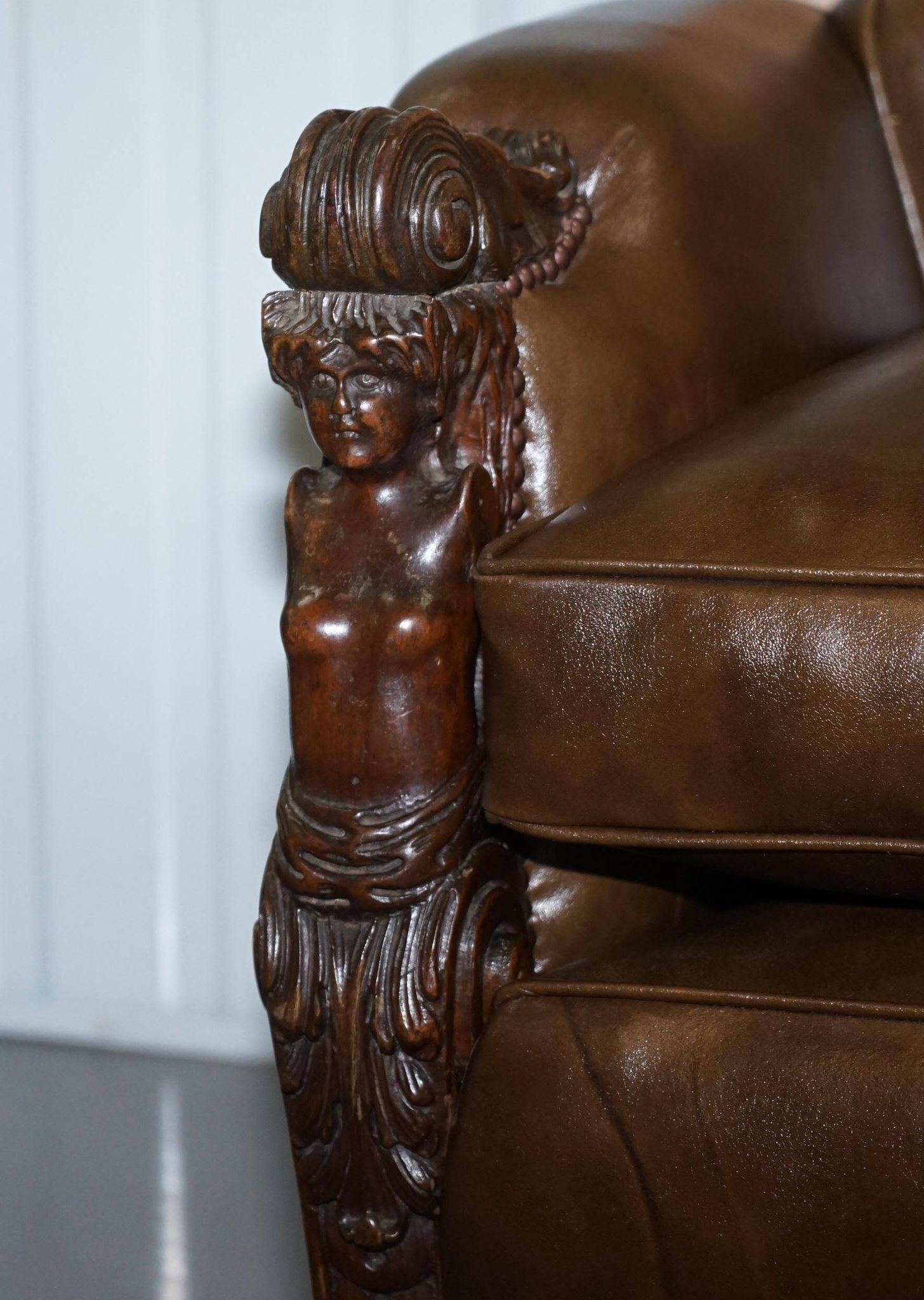 Restored Regency canapé in leather with sculpted Hermès frame.