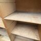 Oak two-column filing cabinet with curtains.