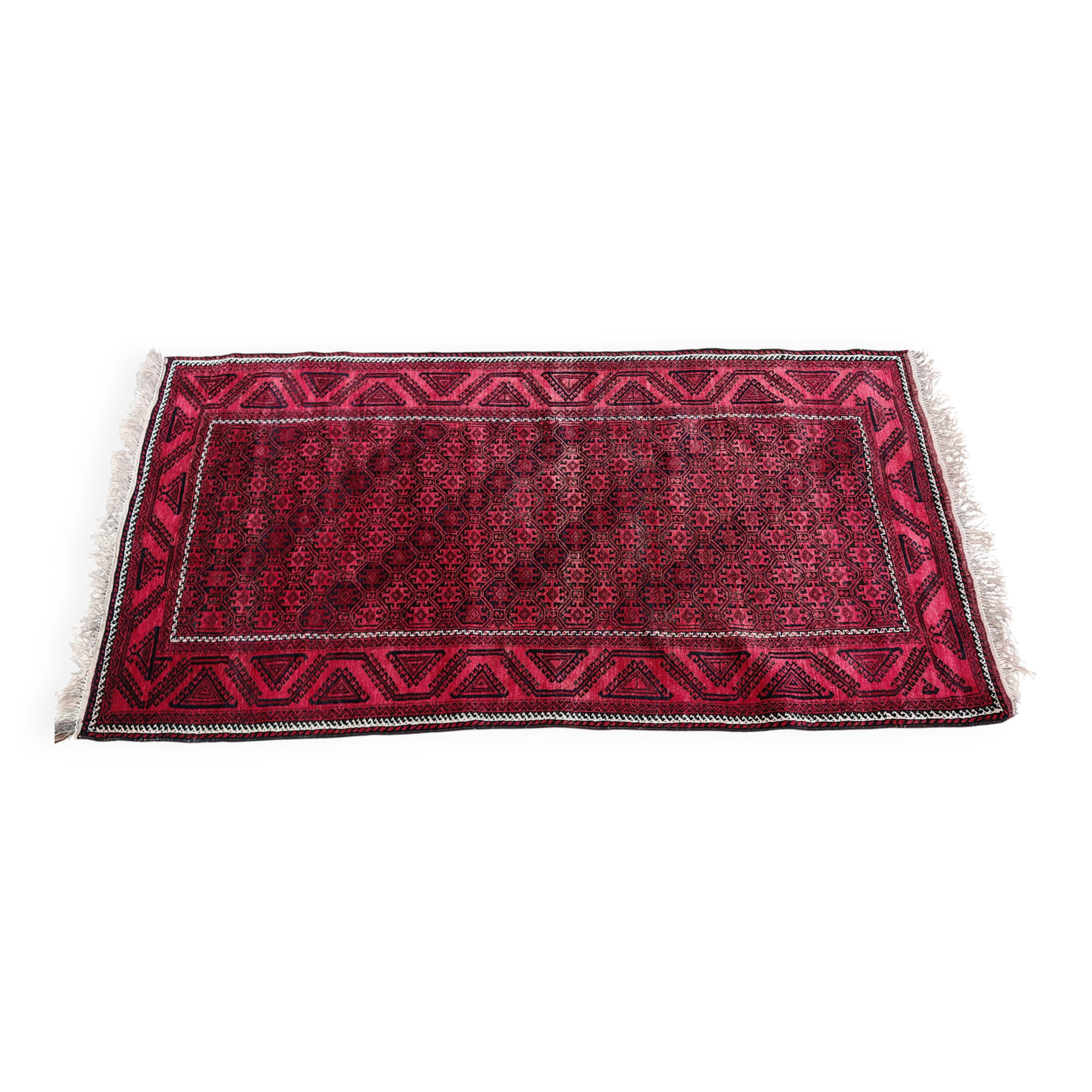 Vintage handmade Baluch rug with geometric pattern from the 1950s.