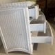 White rattan bedroom set: chest of drawers, mirror, bed, basket